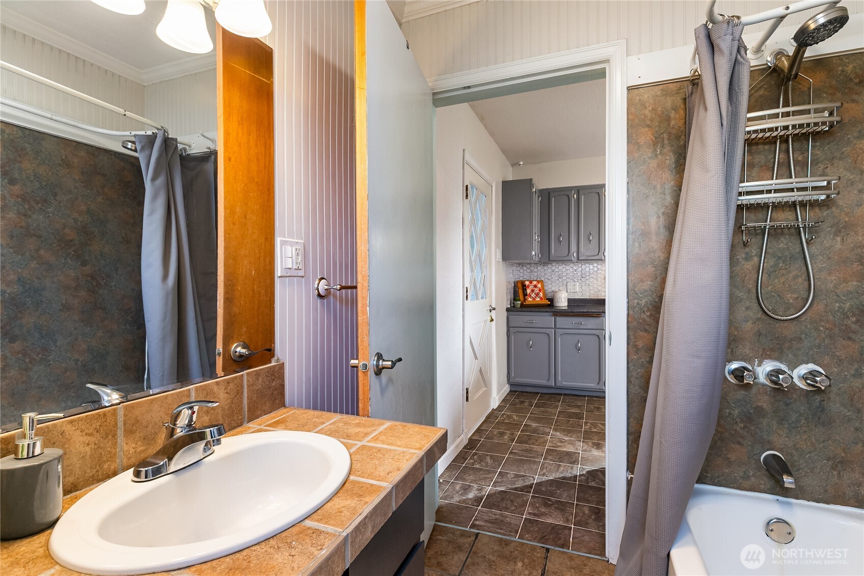 414 Edson Street Lynden, WA 98264 - Photo 26 of 32 a bathroom with a sink and a mirror