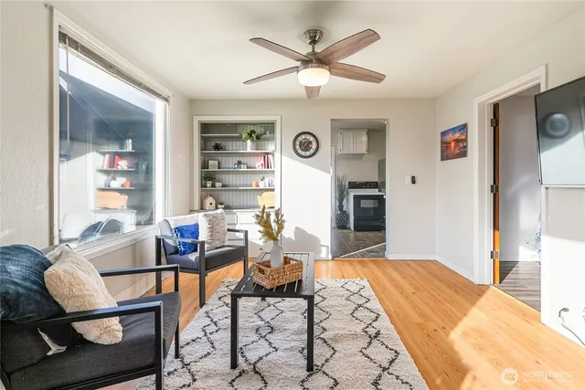 a living room with furniture and a window