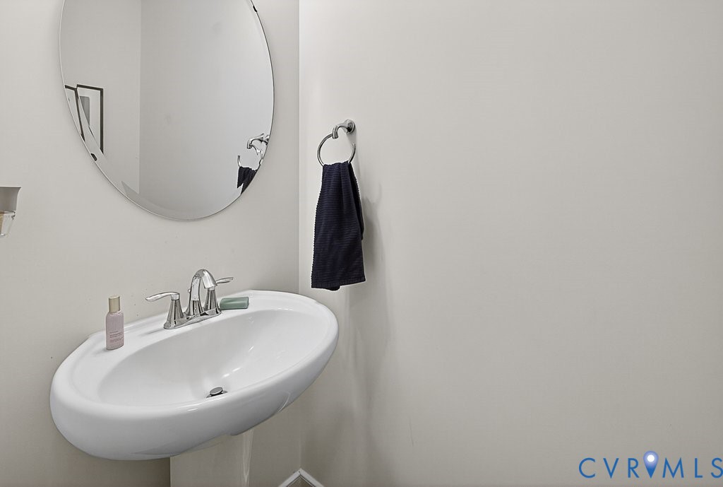 18517 Palisades Ridge Moseley, VA 23120 - Photo 17 of 55 a bathroom with a sink and mirror
