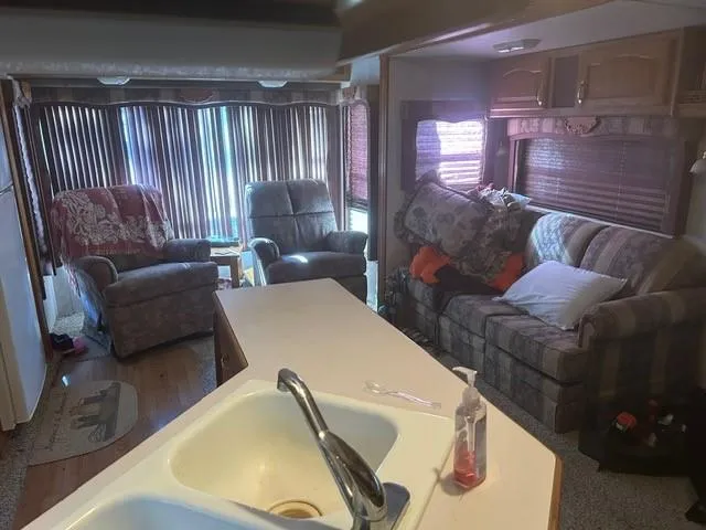 a bed sitting in a room next to a window