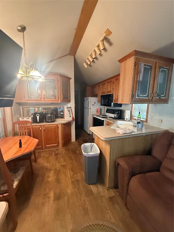 314 Blackjack Street Yantis, TX 75497 - Photo 14 of 26 a living room with furniture and a chandelier