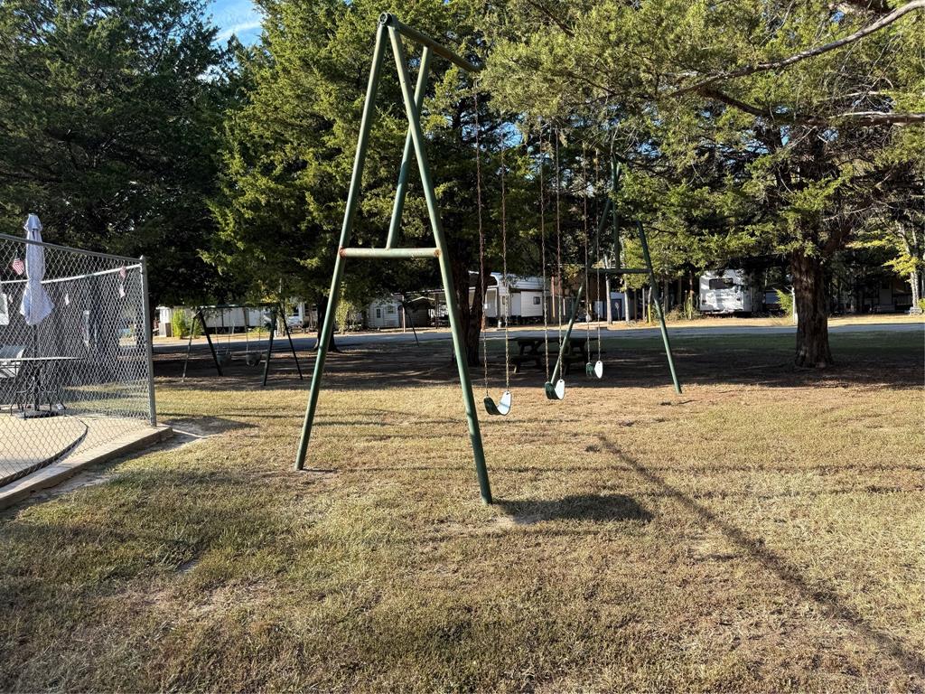 314 Blackjack Street Yantis, TX 75497 - Photo 19 of 26 a view of a park with swings