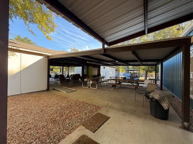 a view of a chairs and tables in patio
