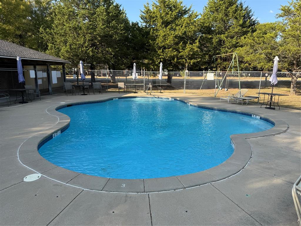 314 Blackjack Street Yantis, TX 75497 - Photo 5 of 26 a view of a swimming pool with outdoor seating
