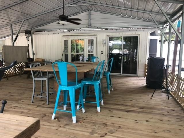 314 Blackjack Street Yantis, TX 75497 - Photo 6 of 26 a view of a dining room with furniture window and wooden floor