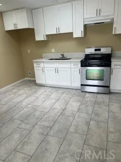 a kitchen with cabinets and appliances