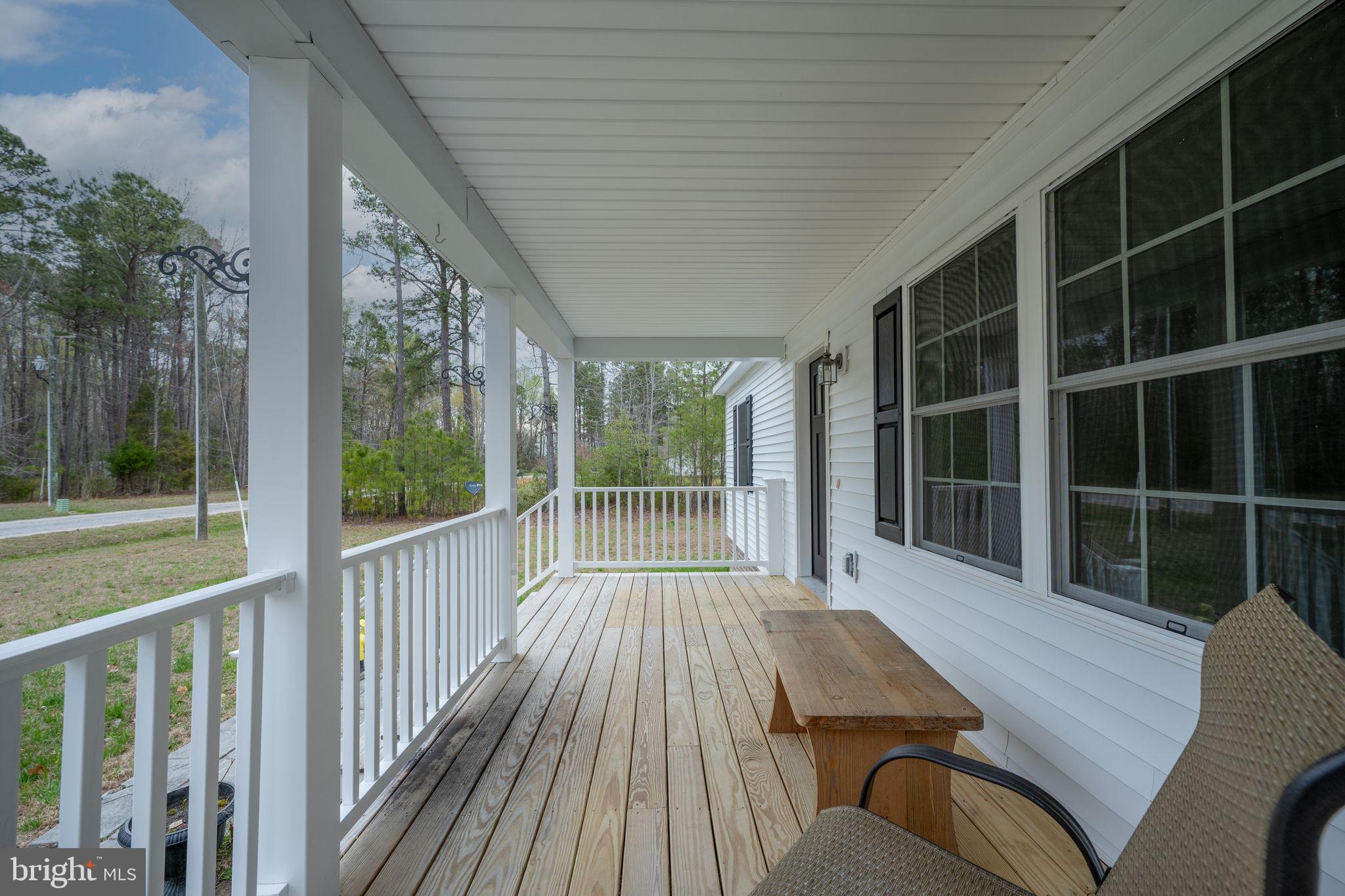 300 River Oaks Road Center Cross, VA 22437 - Photo 6 of 39 Charming porch with serene views.