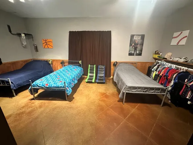 a living room with furniture and a lamp