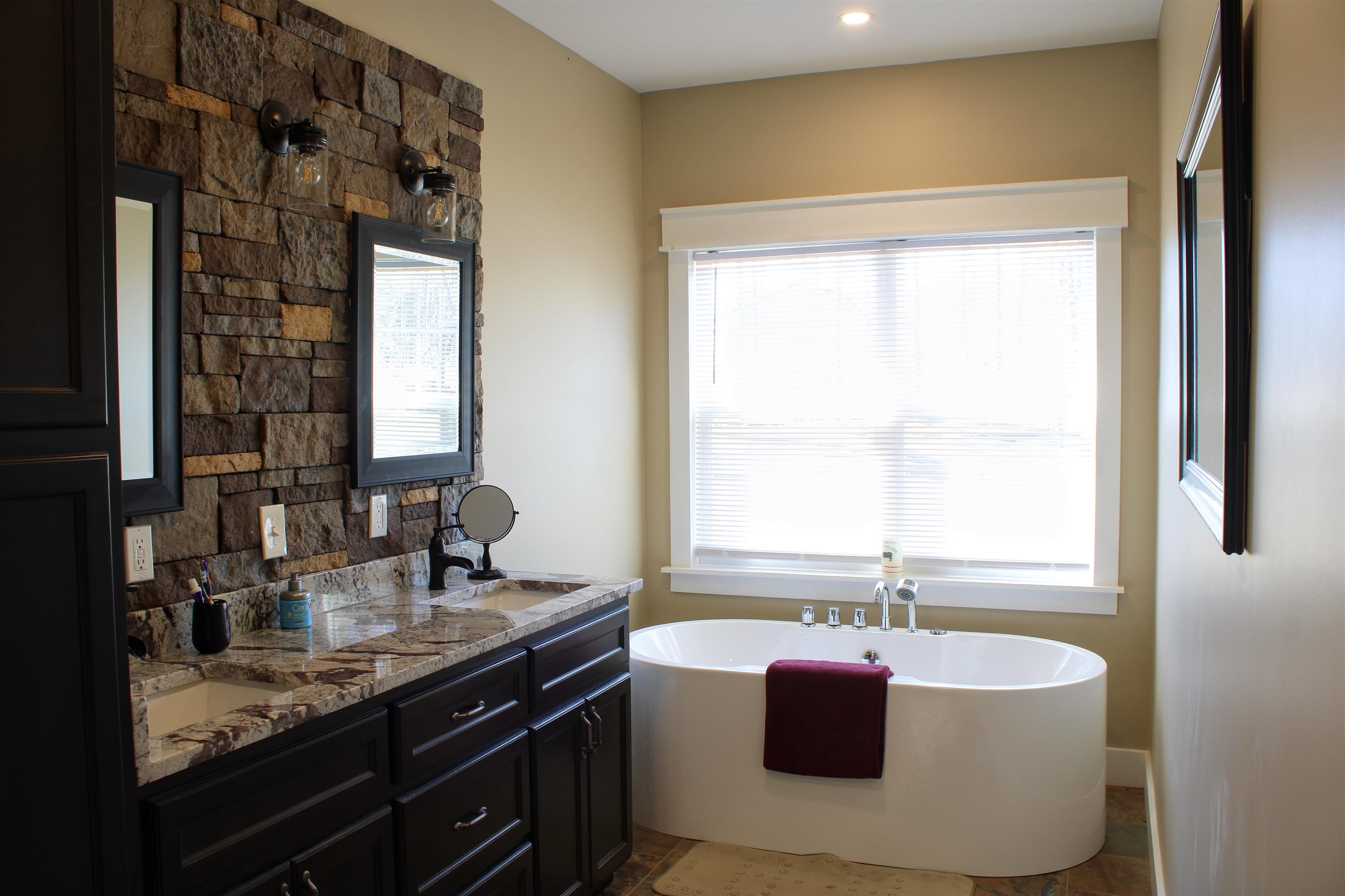 5205 Hamburg Road Michie, TN 38357 - Photo 15 of 40 a bathroom with a granite countertop sink and a bathtub