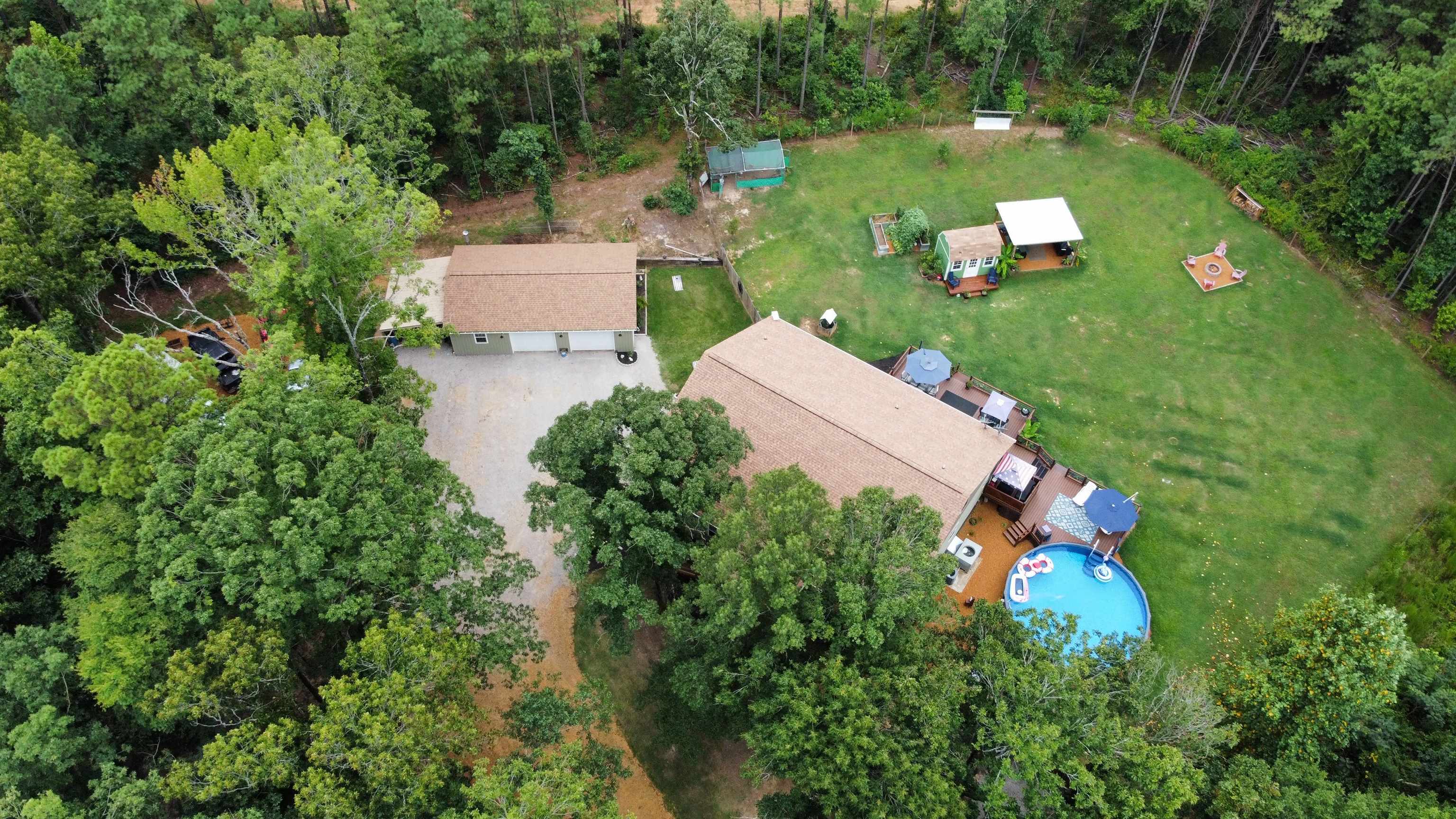 5205 Hamburg Road Michie, TN 38357 - Photo 26 of 40 an aerial view of a house with a garden and lake view