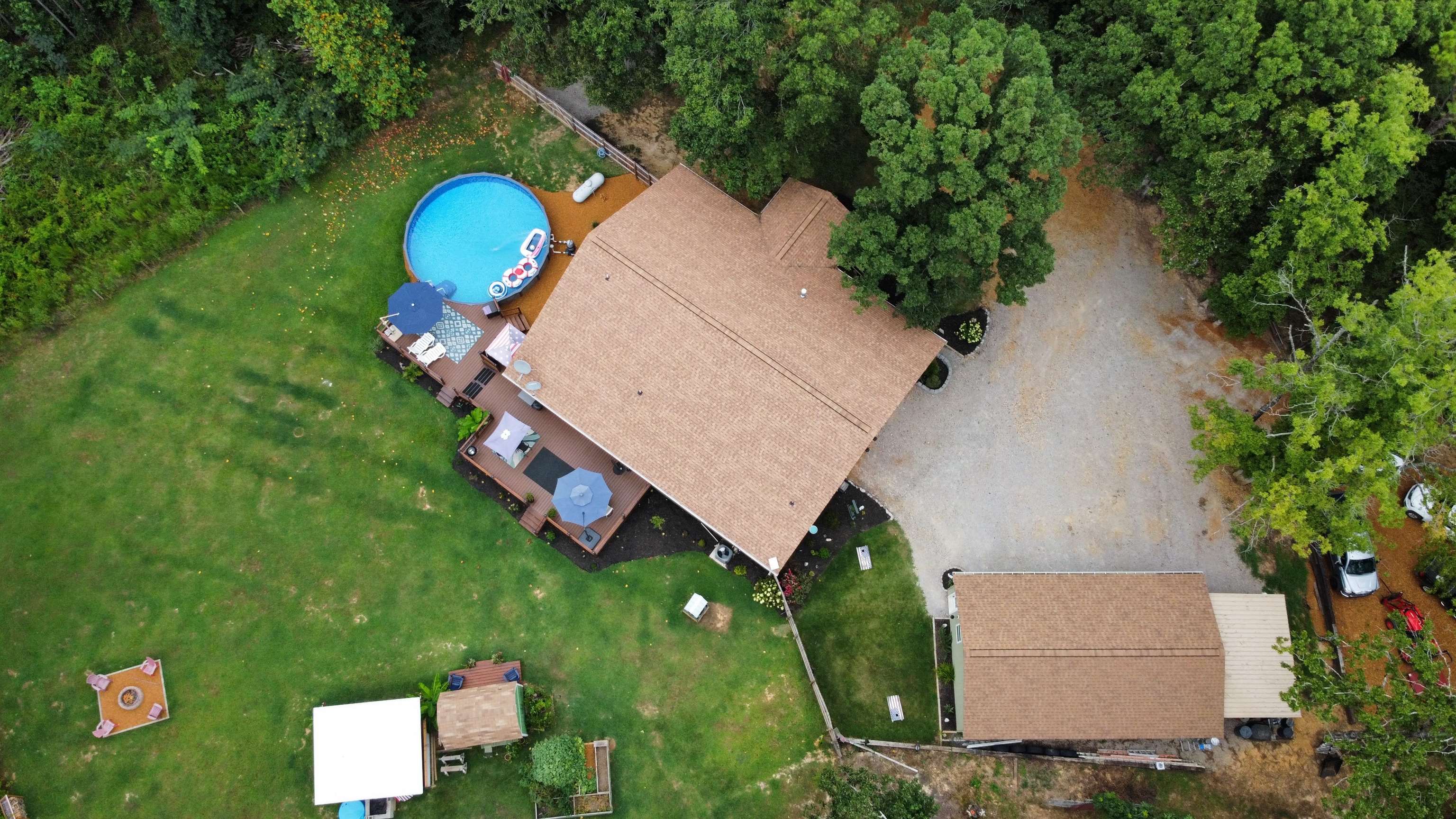 5205 Hamburg Road Michie, TN 38357 - Photo 3 of 40 an aerial view of a house with a swimming pool outdoor seating and yard