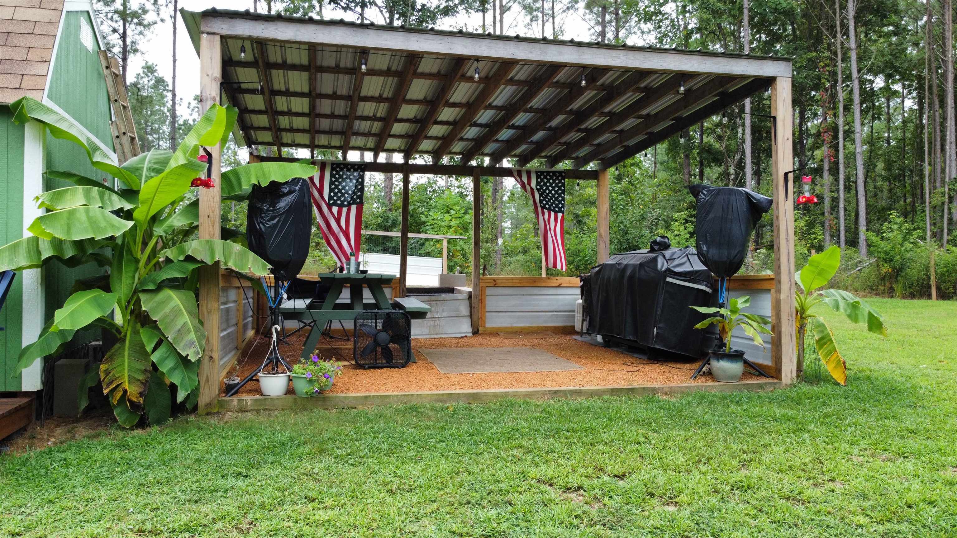 5205 Hamburg Road Michie, TN 38357 - Photo 31 of 40 Covered BBQ area adds charm and function—fire up the grill rain or shine and enjoy meals under the open sky.