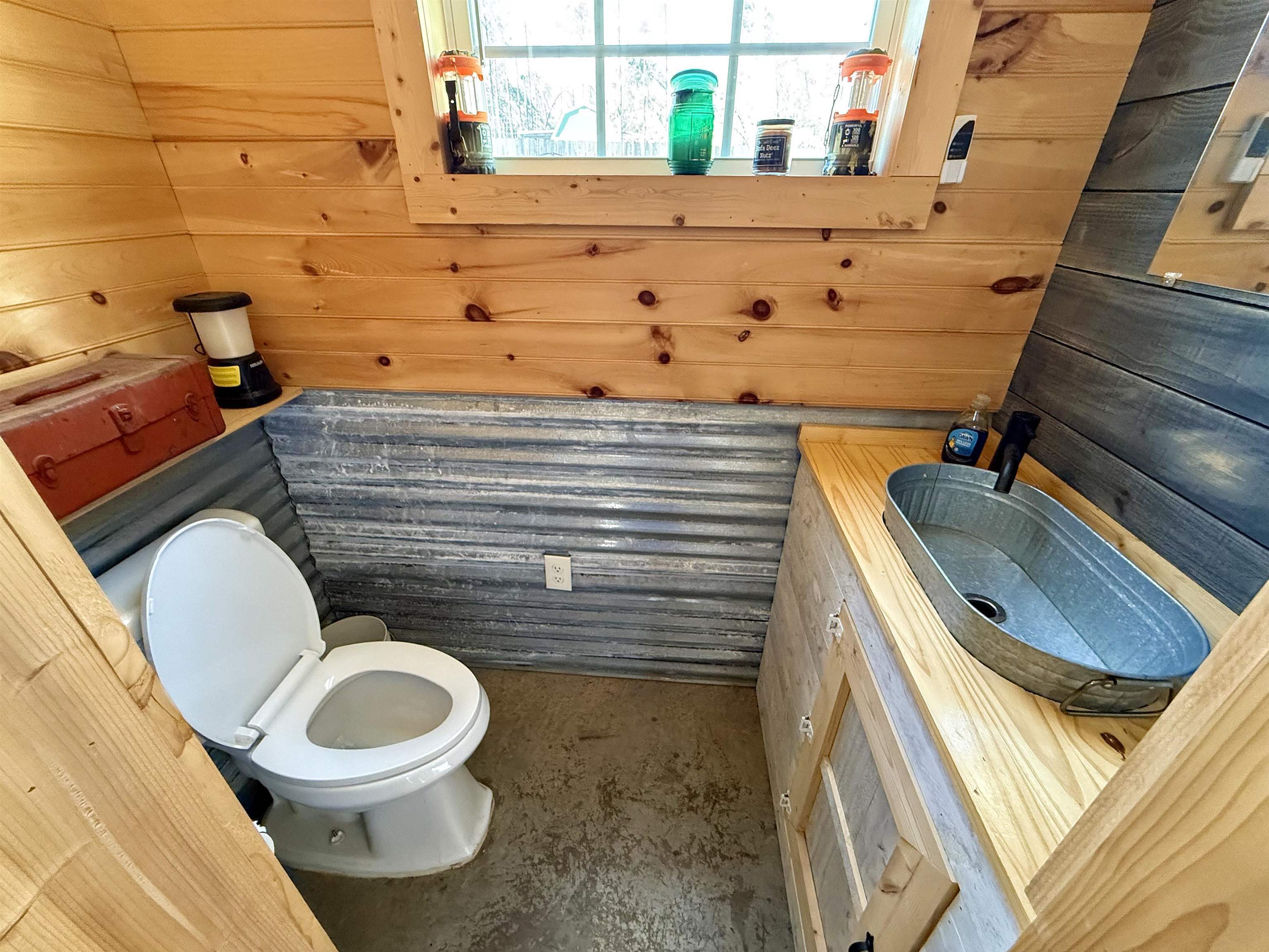 5205 Hamburg Road Michie, TN 38357 - Photo 39 of 40 Half bath with wooden walls and concrete floors