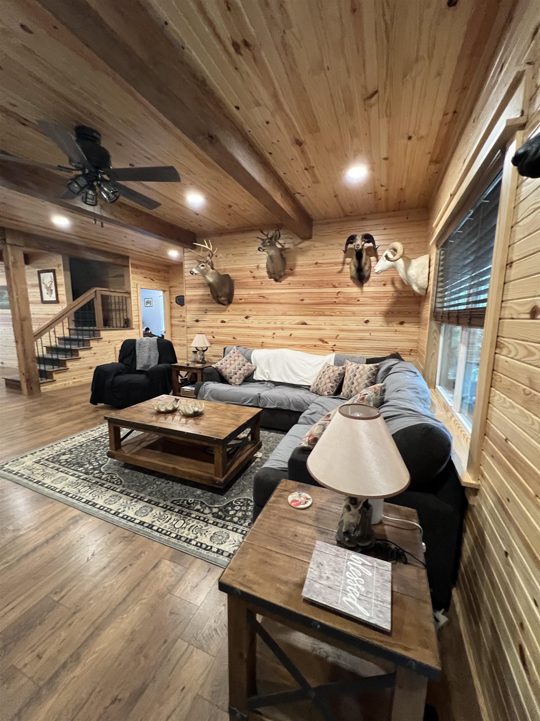 5205 Hamburg Road Michie, TN 38357 - Photo 5 of 40 Living area featuring wood finished floors, recessed lighting, a wood ceiling with exposed beams, wood walls, and stairs