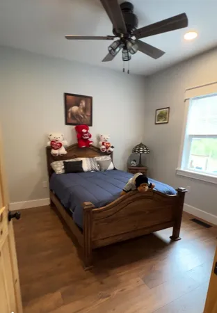 an aerial view of a house with a swimming pool outdoor seating and yard