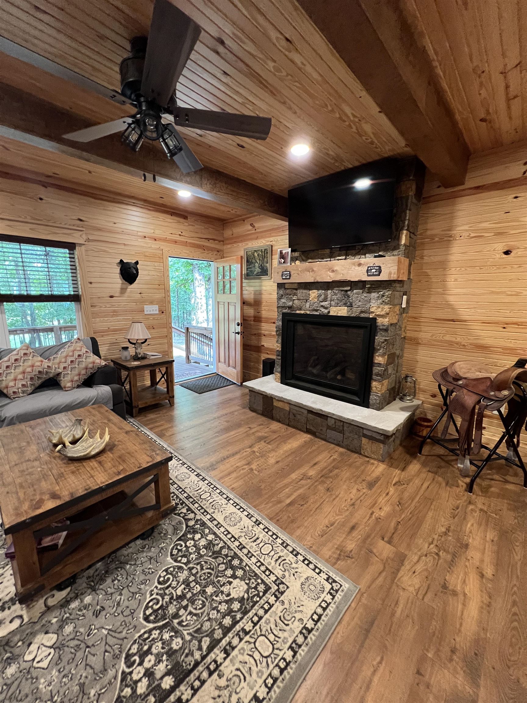 5205 Hamburg Road Michie, TN 38357 - Photo 8 of 40 a living room with furniture flat screen tv and a fireplace