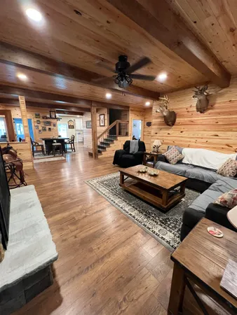 a living room with lots of furniture and a fireplace