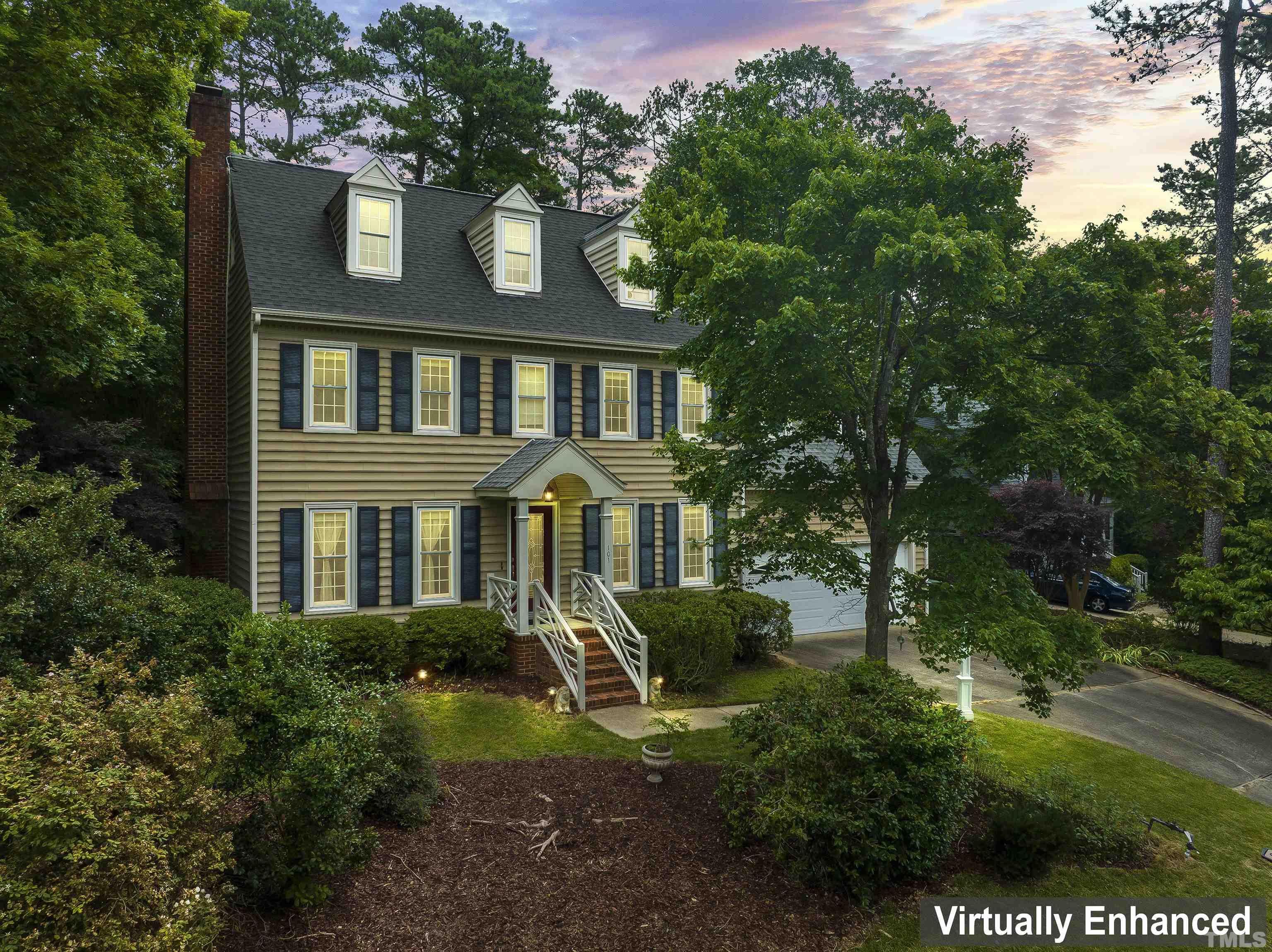 101 Vicksburg Drive Cary, NC 27513 - Photo 2 of 39 a front view of a house with a yard