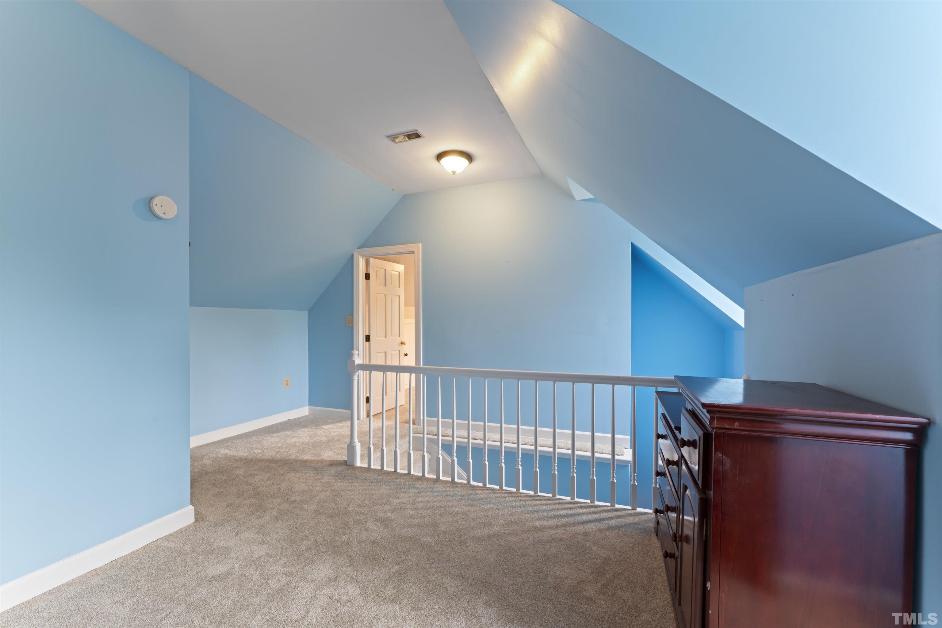 101 Vicksburg Drive Cary, NC 27513 - Photo 23 of 39 a view of a livingroom with a staircase