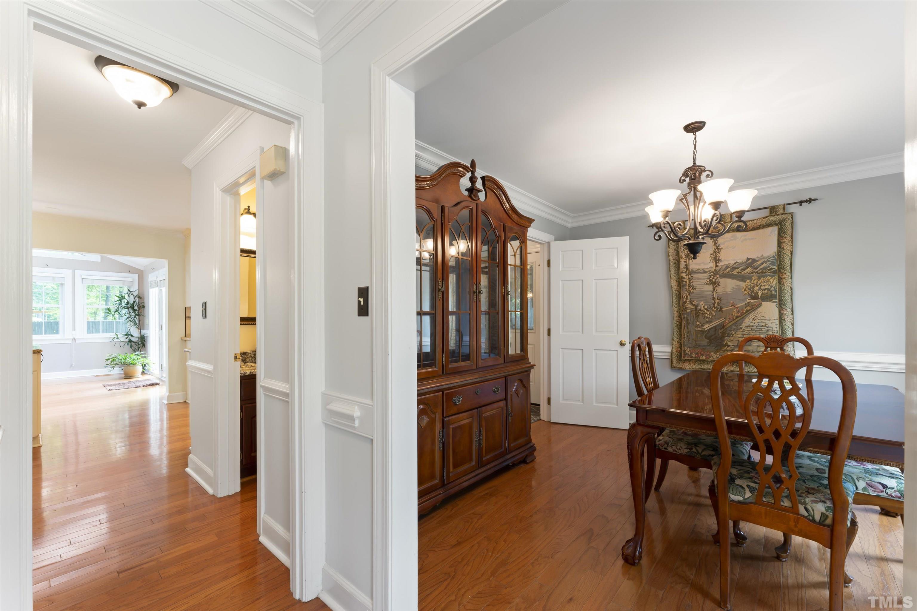 101 Vicksburg Drive Cary, NC 27513 - Photo 33 of 39 a view of a dining room with furniture and wooden floor