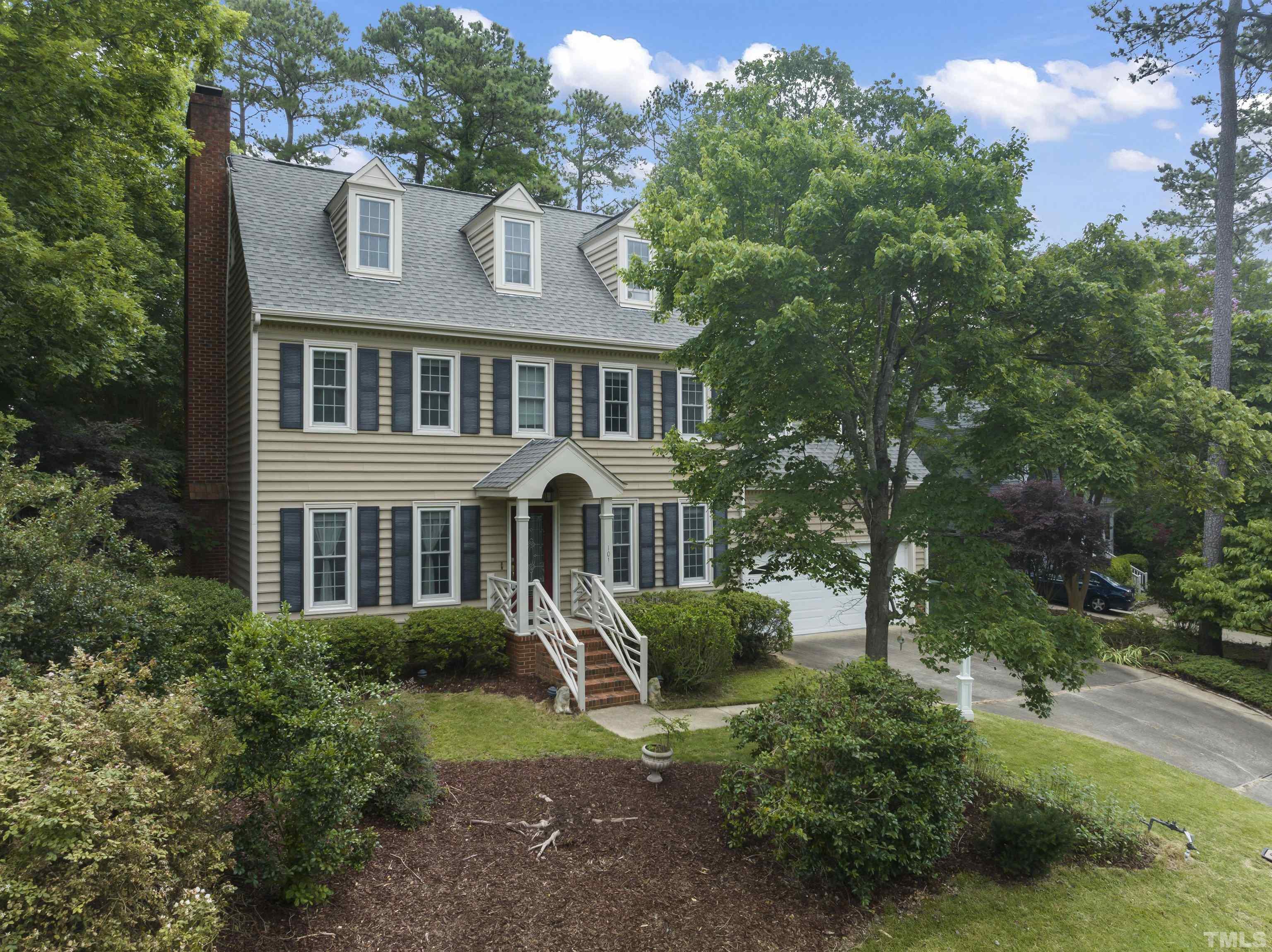 101 Vicksburg Drive Cary, NC 27513 - Photo 35 of 39 a front view of a house with a garden