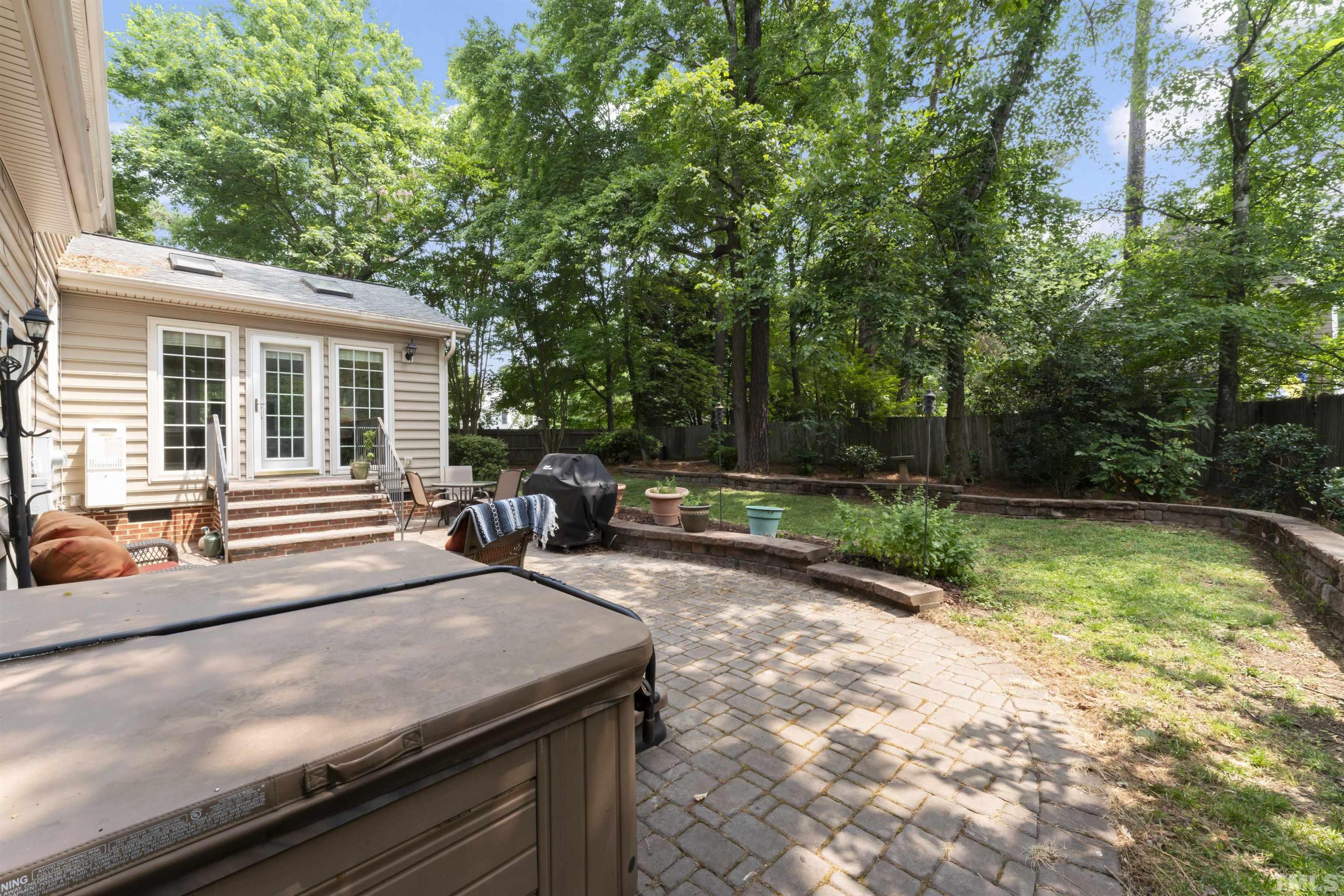 101 Vicksburg Drive Cary, NC 27513 - Photo 6 of 39 a view of a backyard with sitting area