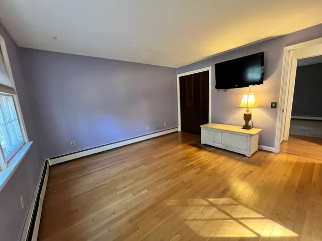 a living room with couch and a flat screen tv