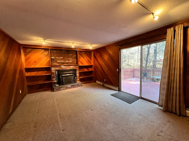 a view of room with furniture and air conditioner