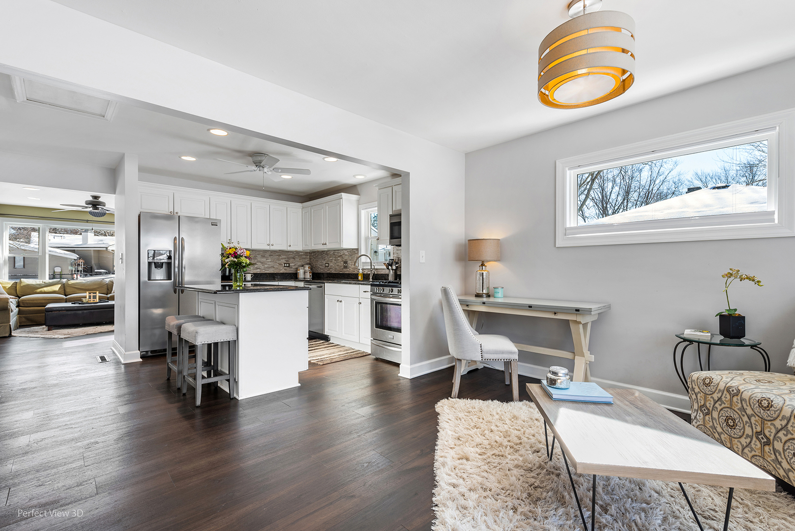 21 Crescent Road Lake Zurich, IL 60047 - Photo 5 of 24 a living room with furniture and a kitchen view