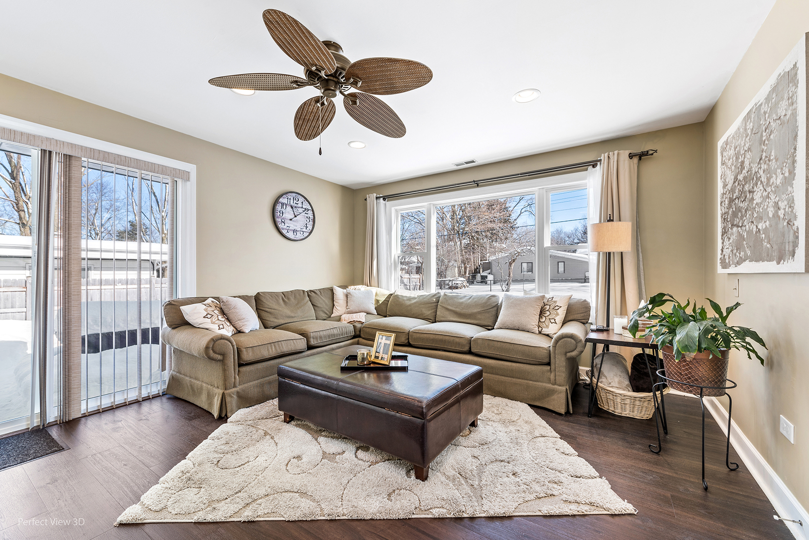 21 Crescent Road Lake Zurich, IL 60047 - Photo 10 of 24 a living room with furniture ceiling fan and a large window