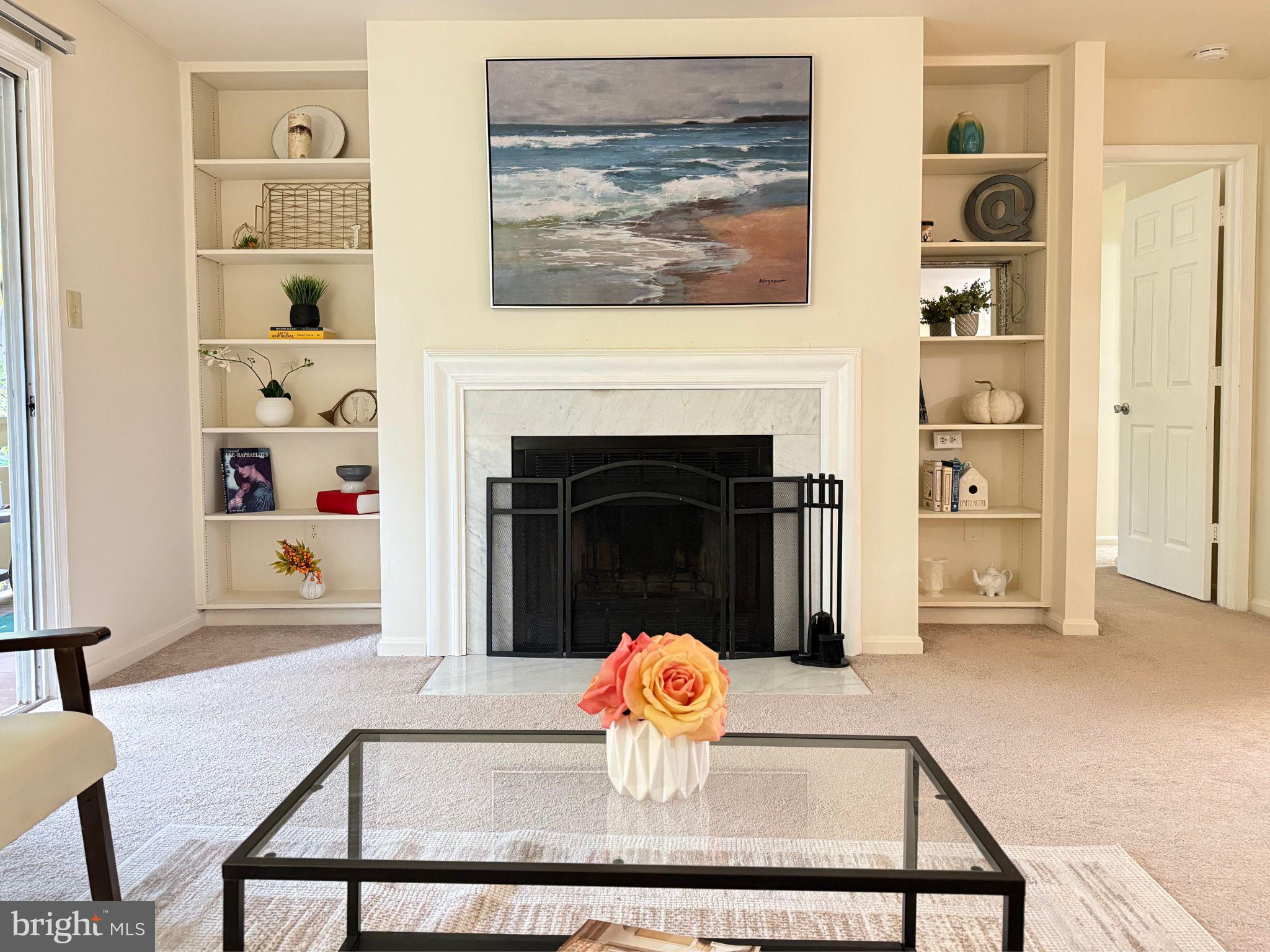 11713 Karbon Hill Court, Unit 710A Reston, VA 20191 - Photo 1 of 19 a living room with furniture and a fireplace
