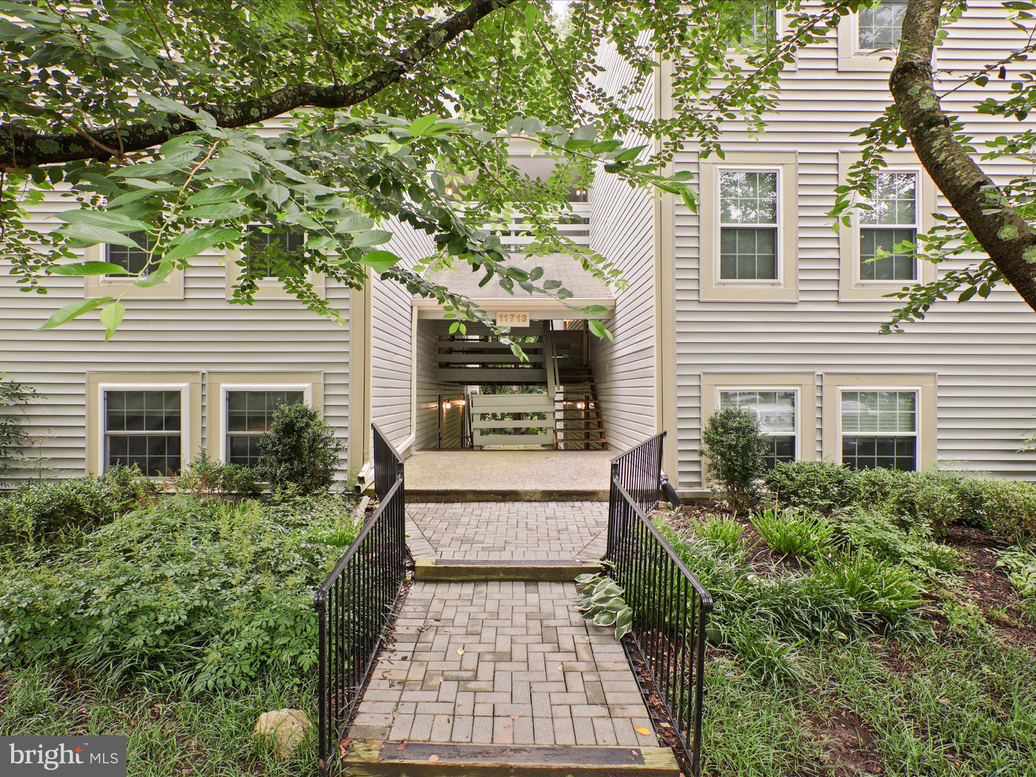 11713 Karbon Hill Court, Unit 710A Reston, VA 20191 - Photo 19 of 19 a view of a house with backyard and sitting area