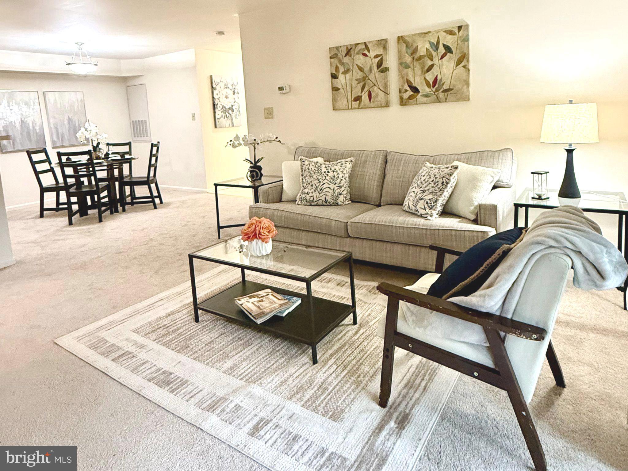 11713 Karbon Hill Court, Unit 710A Reston, VA 20191 - Photo 4 of 19 a living room with furniture and wooden floor