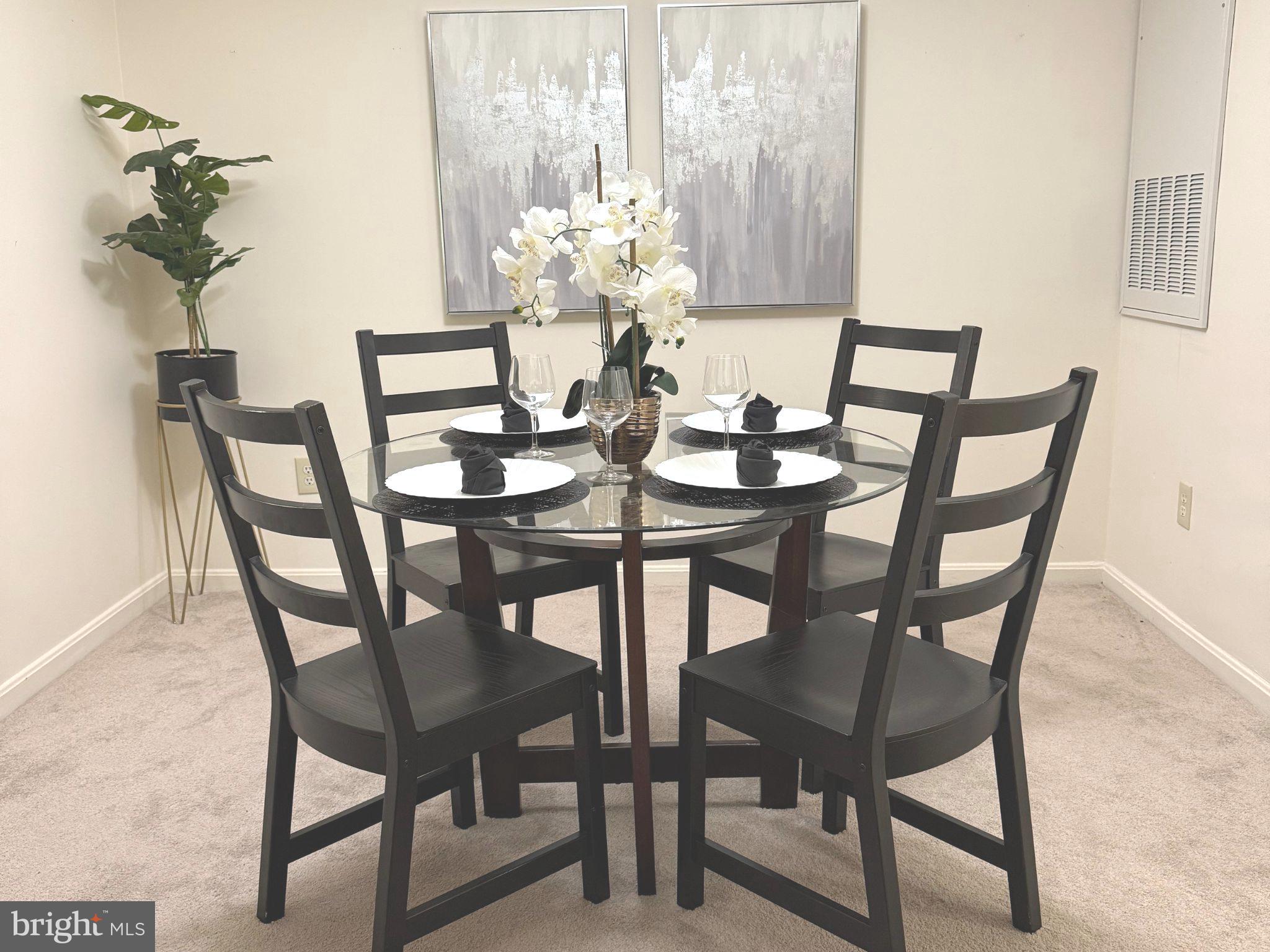 11713 Karbon Hill Court, Unit 710A Reston, VA 20191 - Photo 5 of 19 a dining room with furniture and wooden floor