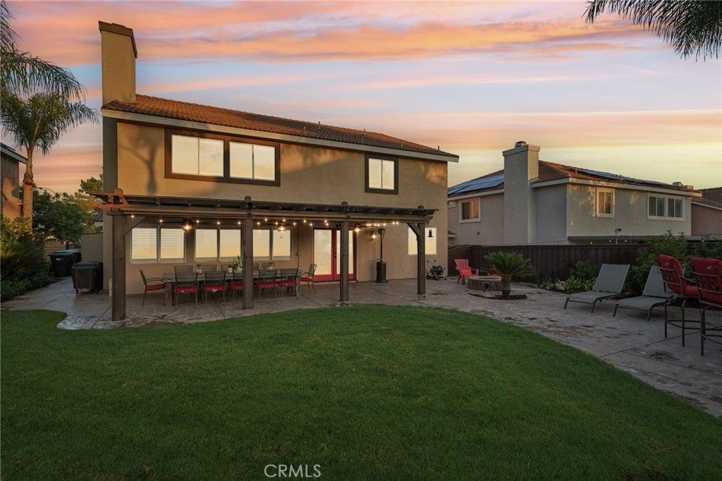 2575 Gilbert Avenue Corona, CA 92881 - Photo 2 of 58 a view of a house with a yard and sitting area