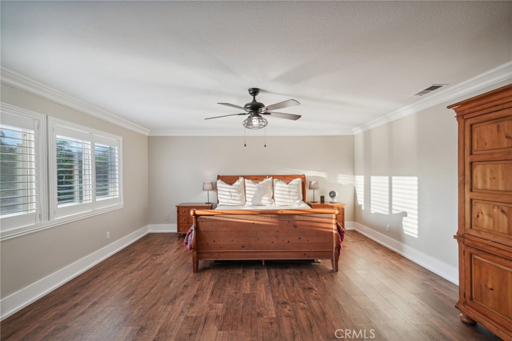2575 Gilbert Avenue Corona, CA 92881 - Photo 22 of 58 a living room with a bed furniture and a large window