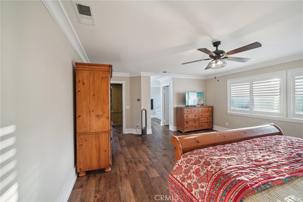 2575 Gilbert Avenue Corona, CA 92881 - Photo 25 of 58 a bedroom with a bed and wooden floor