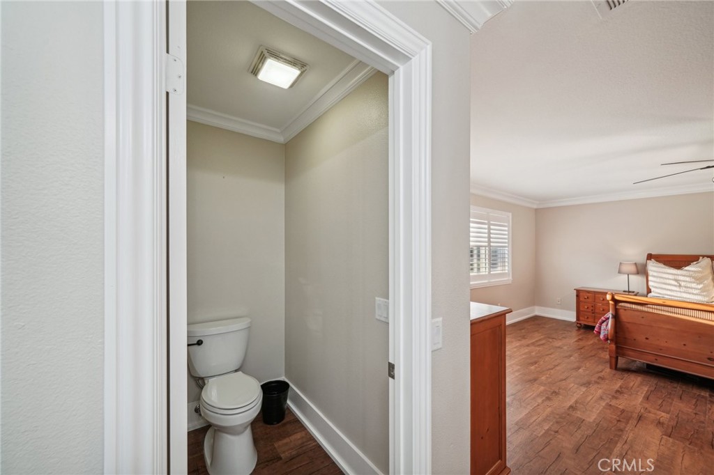 2575 Gilbert Avenue Corona, CA 92881 - Photo 27 of 58 a bathroom with a toilet sink and mirror