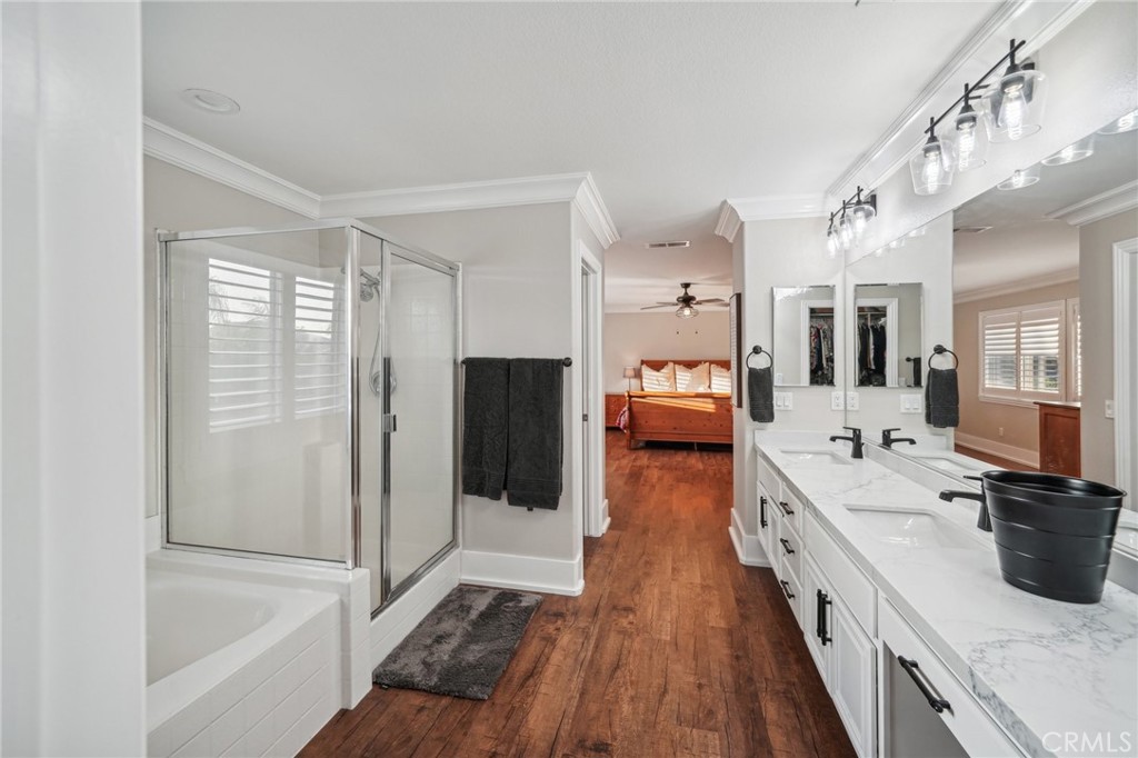 2575 Gilbert Avenue Corona, CA 92881 - Photo 28 of 58 a large white kitchen with a large window a refrigerator and stainless steel appliances
