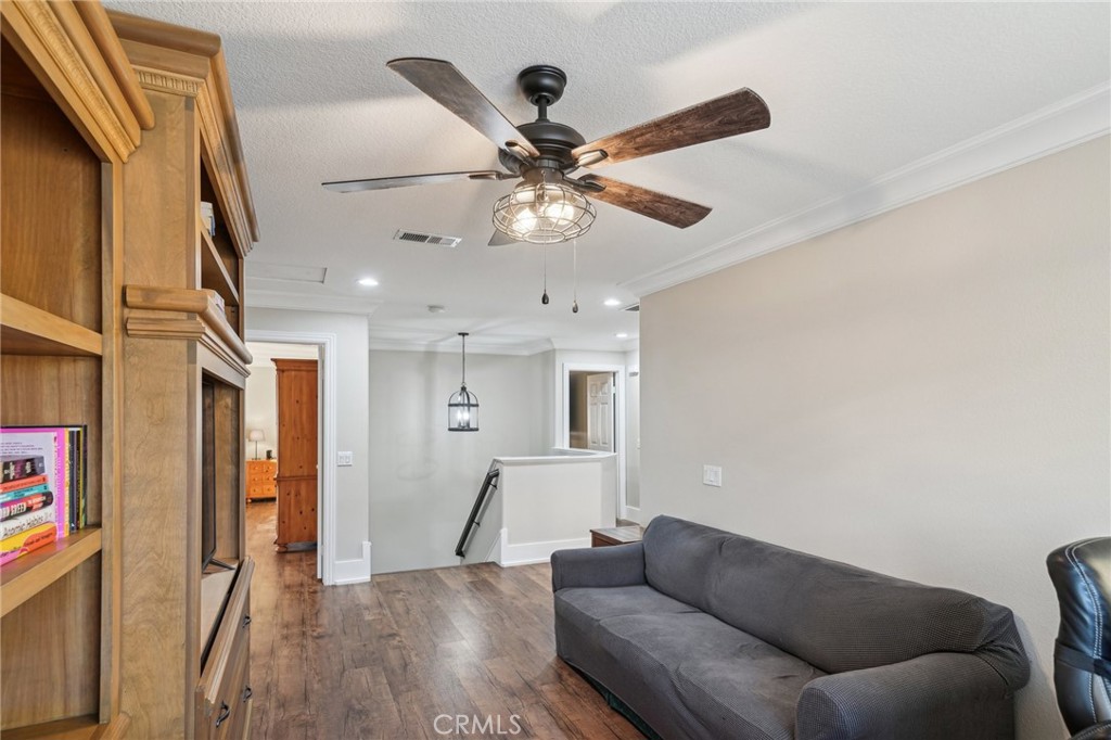 2575 Gilbert Avenue Corona, CA 92881 - Photo 31 of 58 a living room with furniture and a ceiling fan