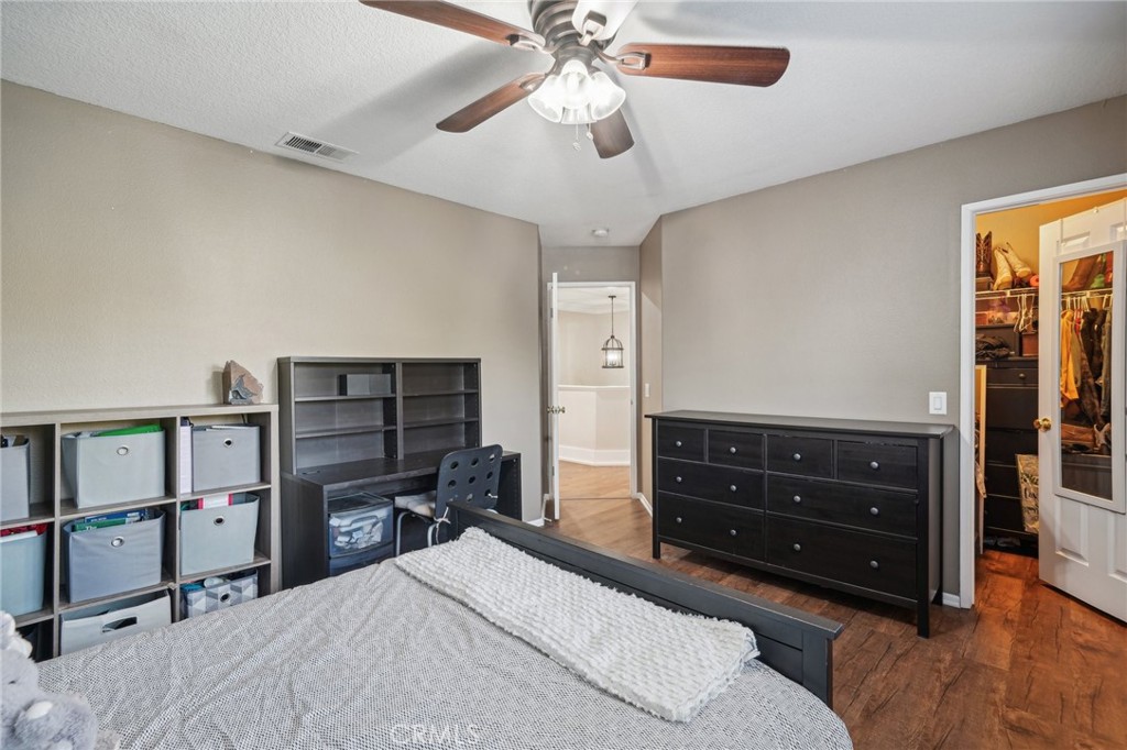 2575 Gilbert Avenue Corona, CA 92881 - Photo 34 of 58 a bedroom with a bed dresser and a window