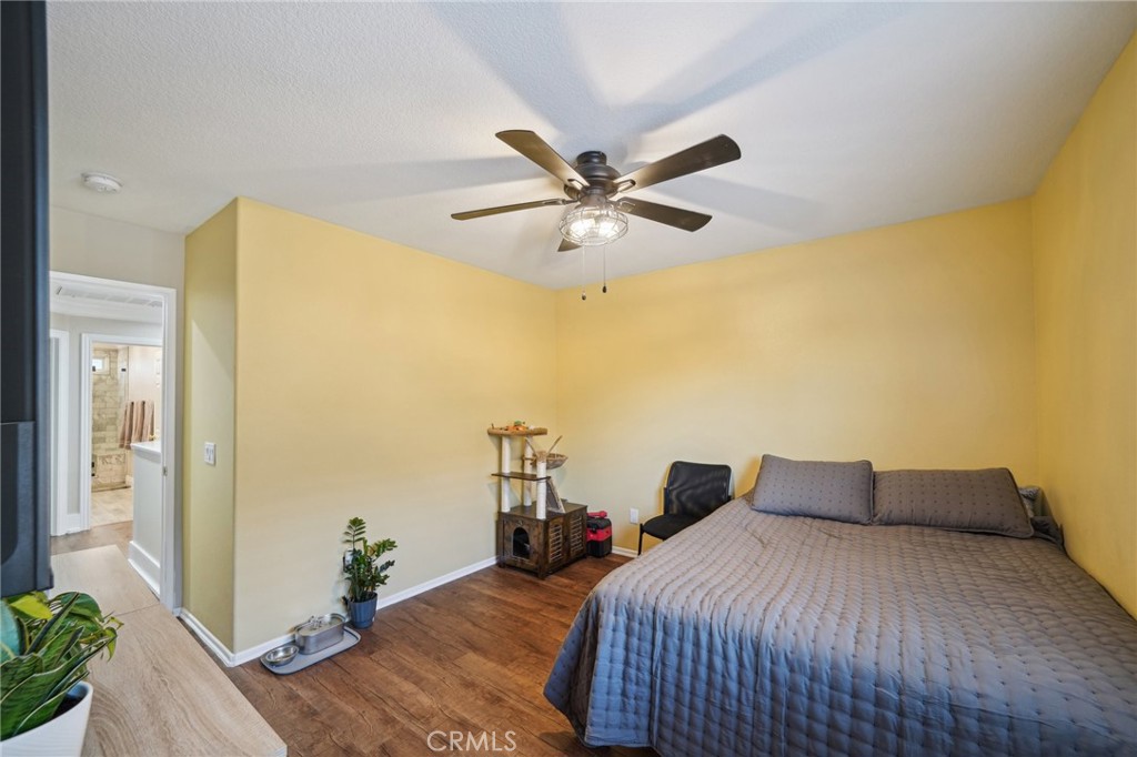 2575 Gilbert Avenue Corona, CA 92881 - Photo 38 of 58 a bedroom with a bed and wooden floor