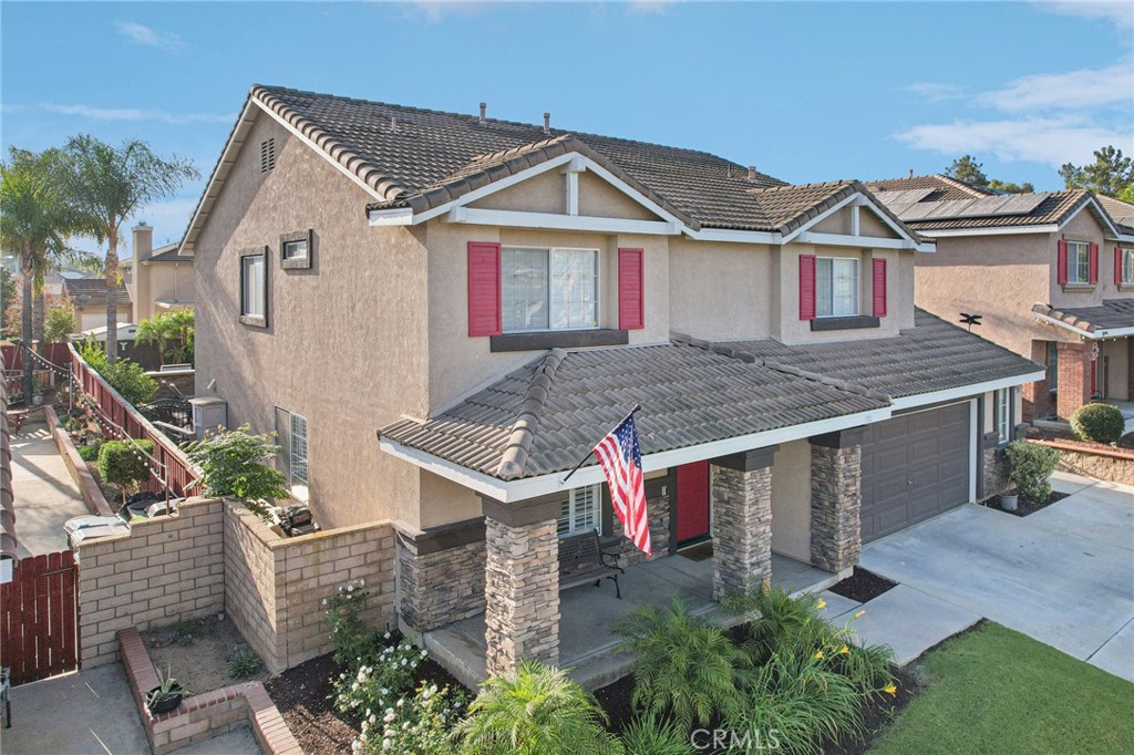 2575 Gilbert Avenue Corona, CA 92881 - Photo 47 of 58 a front view of a house with garden