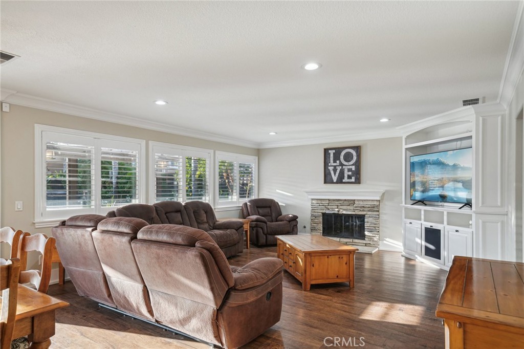 2575 Gilbert Avenue Corona, CA 92881 - Photo 10 of 58 a living room with furniture and a fireplace