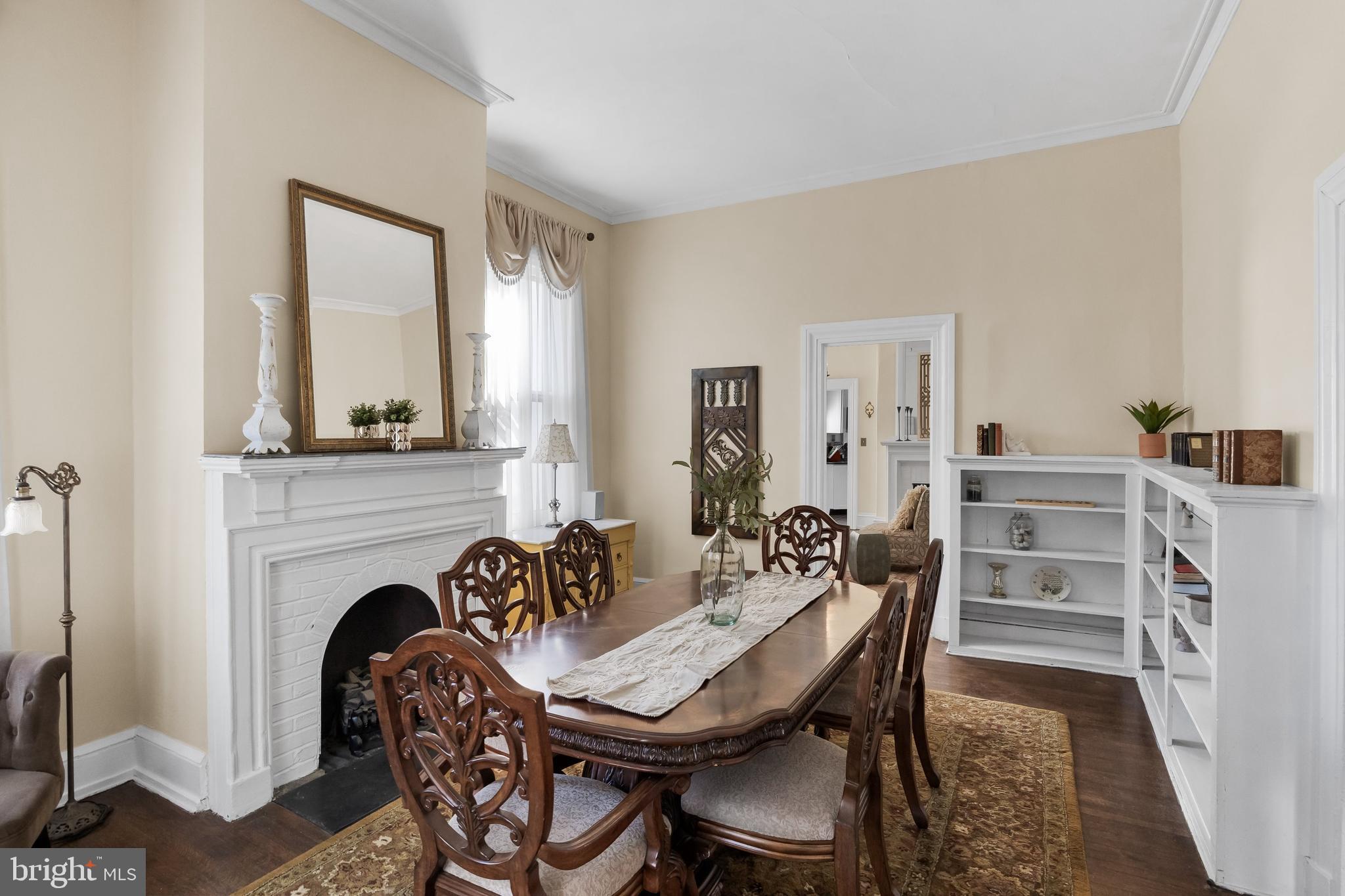 100 Main Street Riverton, NJ 08077 - Photo 15 of 44 a view of a a dining room with furniture and a fireplace