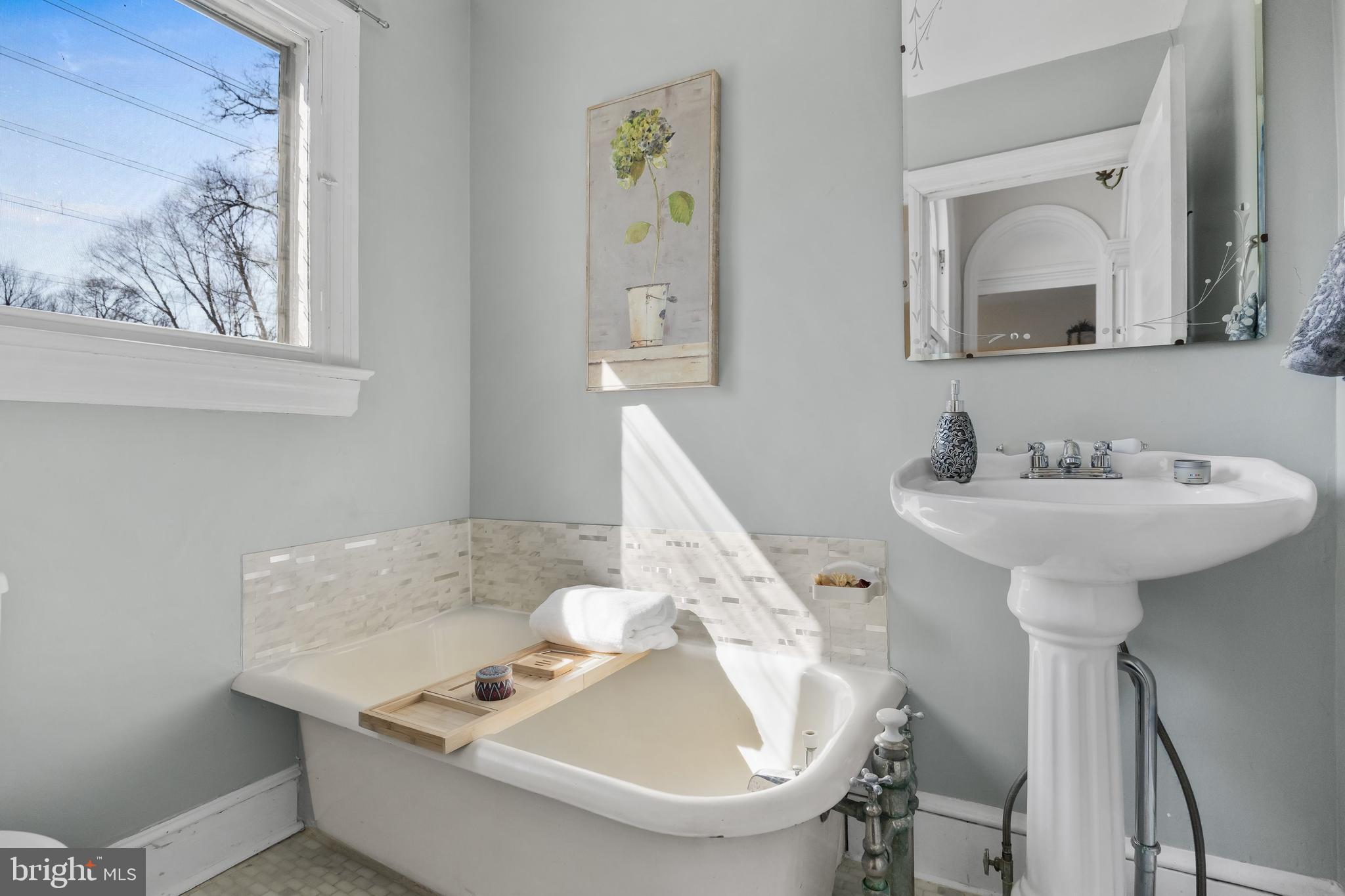 100 Main Street Riverton, NJ 08077 - Photo 34 of 44 a bathroom with a sink and a mirror