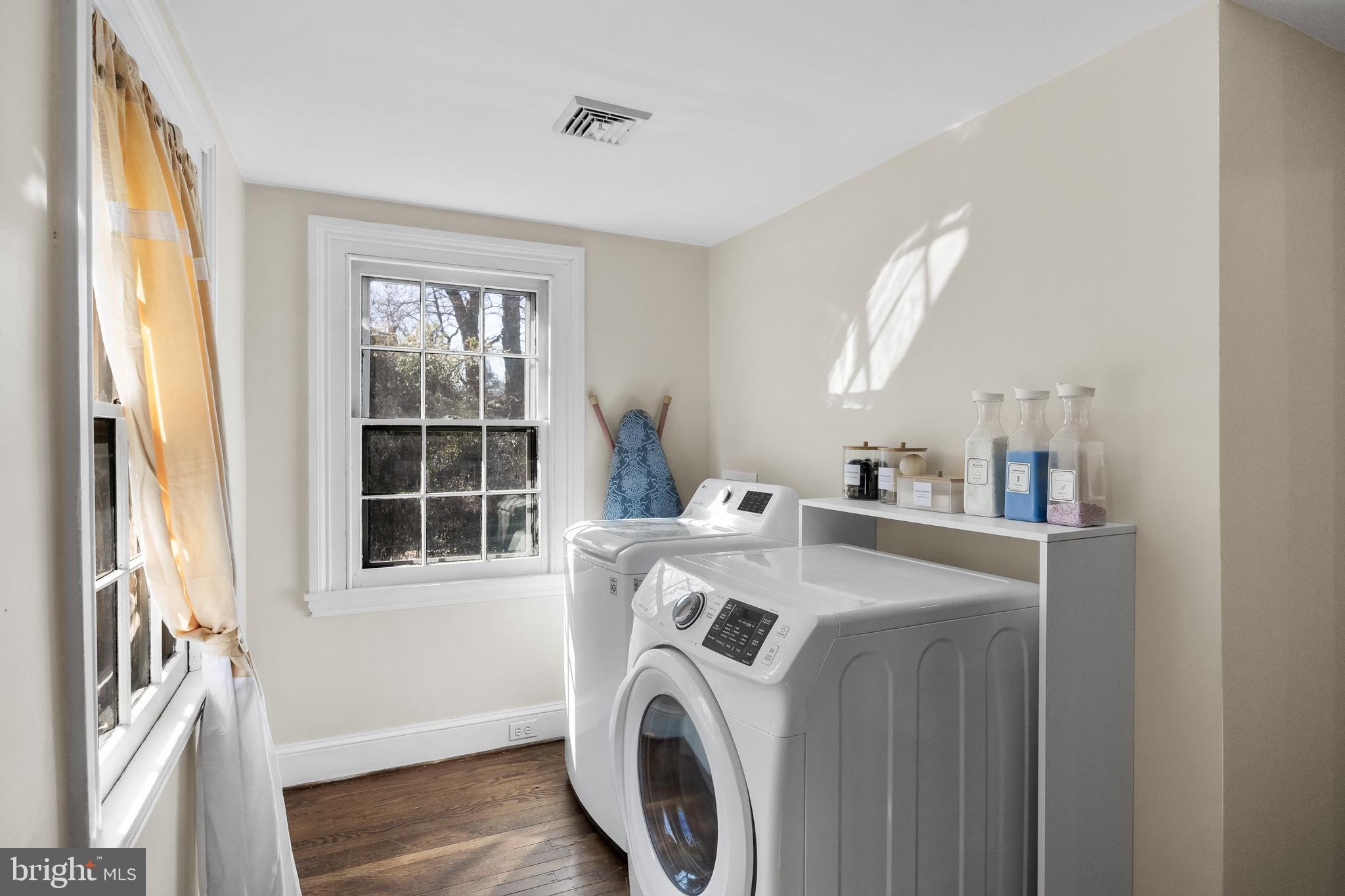 100 Main Street Riverton, NJ 08077 - Photo 35 of 44 a view of washer and dryer with kitchen in the background
