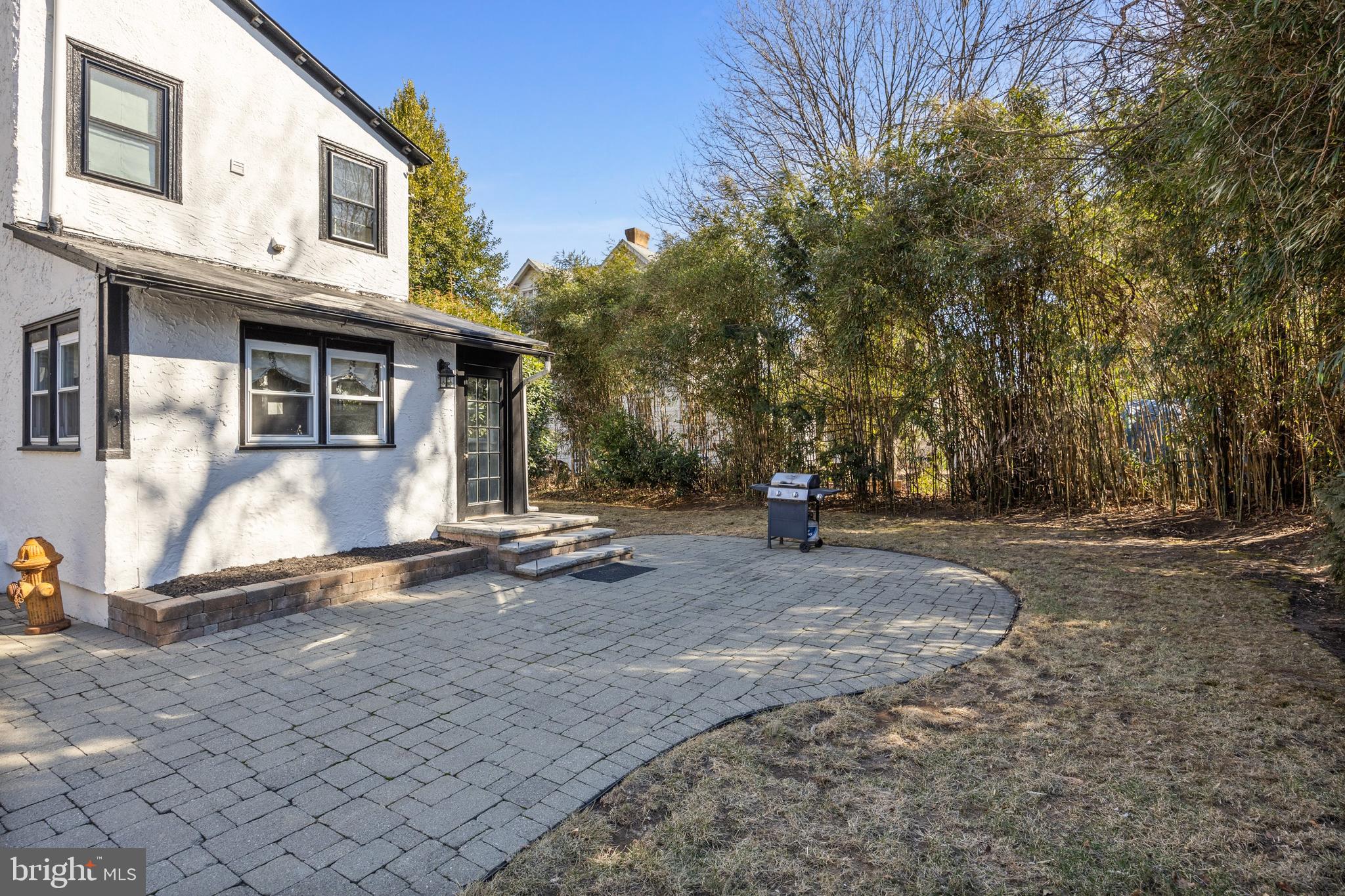 100 Main Street Riverton, NJ 08077 - Photo 39 of 44 a view of a house with backyard and a tree