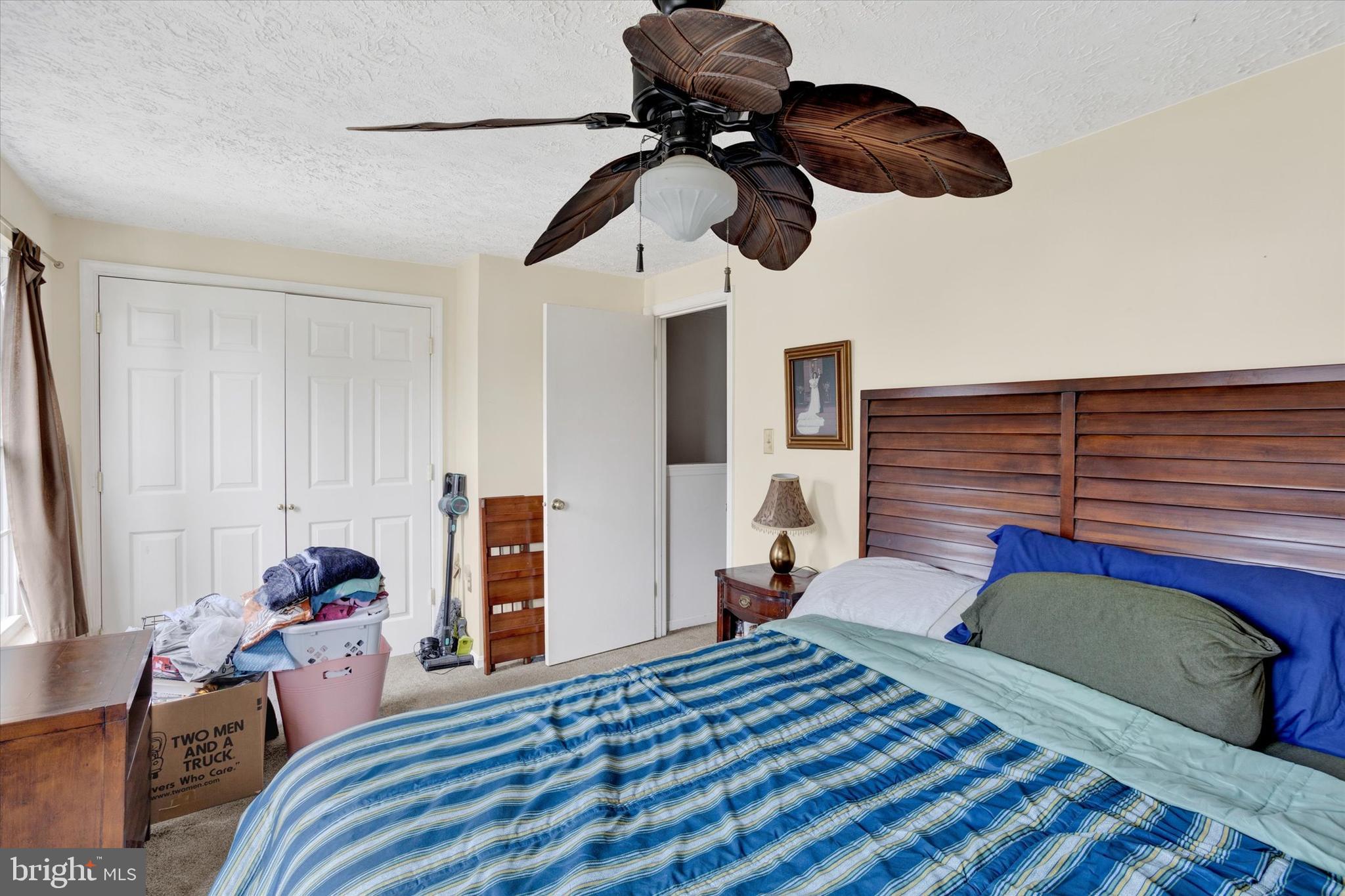 7278 Procopio Circle Columbia, MD 21046 - Photo 17 of 30 a bedroom with a bed and a chandelier