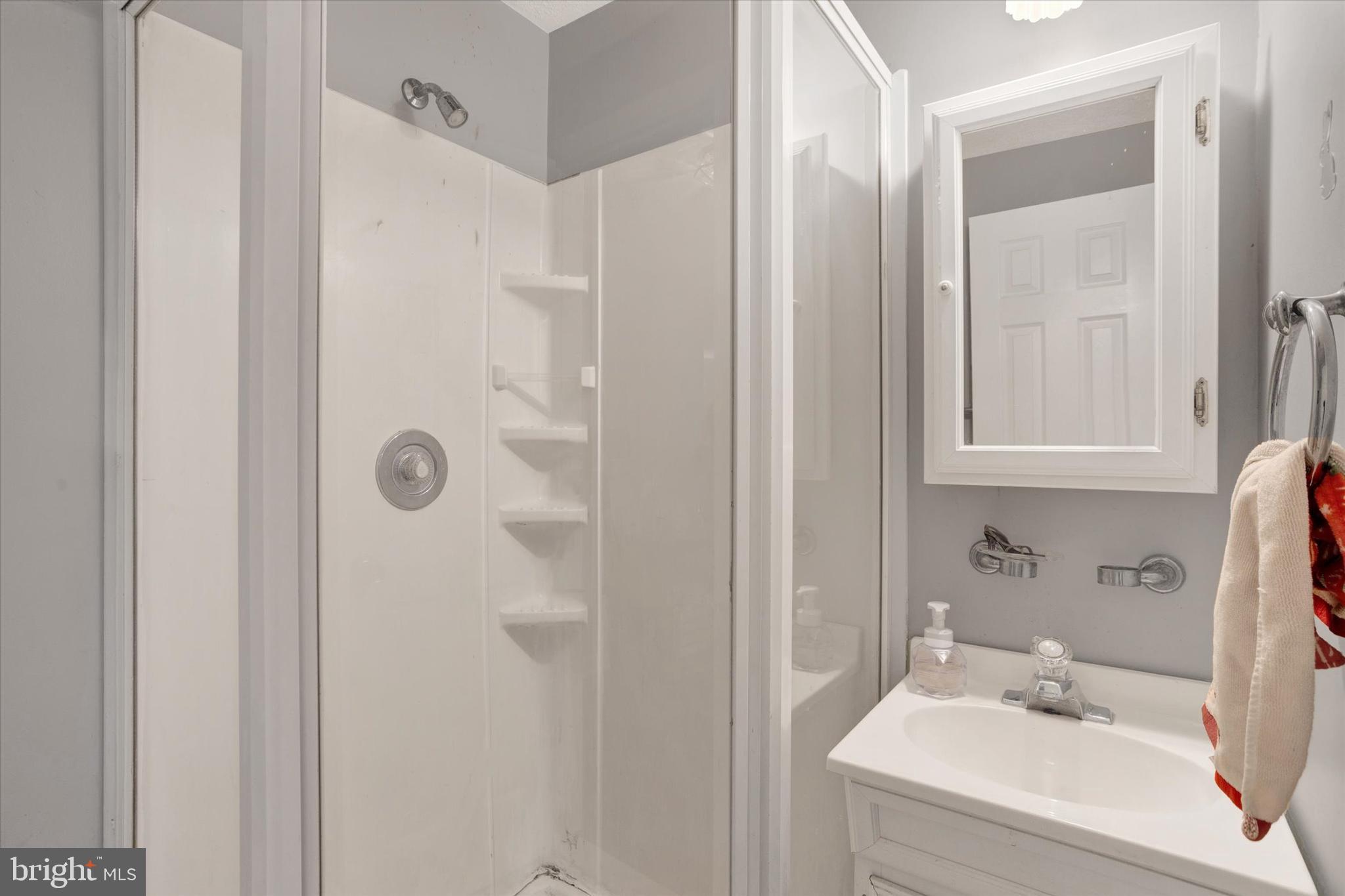 7278 Procopio Circle Columbia, MD 21046 - Photo 19 of 30 a bathroom with a sink and a mirror